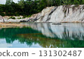 Abandoned quarry pond with green turquoise water. 131302487