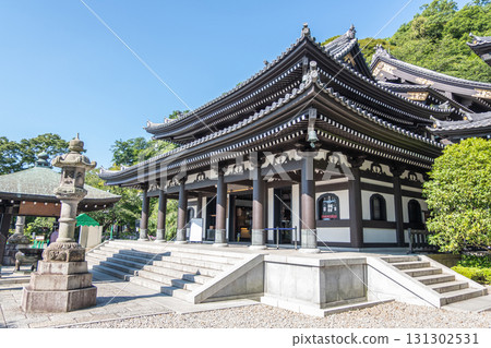 Traditional Japanese temple building in serene garden under clear sky at Kamakura, Kanagawa, Japan 131302531