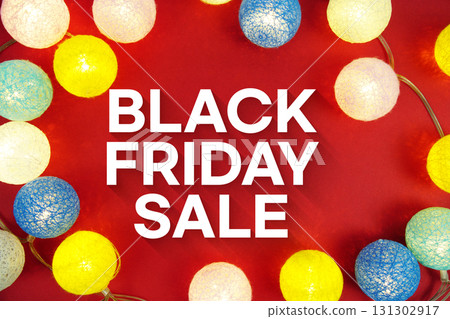 Black Friday Sale text with LED Light Cotton ball Decoration on red background Black Friday Sale text with LED Light Cotton ball Decoration on red background 131302917