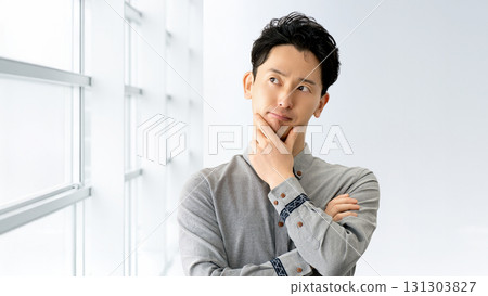A male businessman thinking 131303827