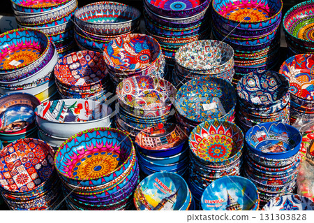 Colorful ceramic plates displayed for sale at a Turkish bazaar, representing traditional craftsmanship, oriental design, and vibrant market culture. Colorful ceramic plates displayed for sale at a Turkish bazaar, representing traditional craftsmanship, oriental design, and vibrant market culture. 131303828