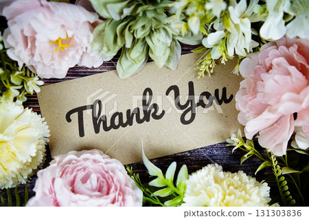 Thank You text with flowers bouquet decoration on wooden background Thank You text with flowers bouquet decoration on wooden background 131303836