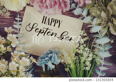 Happy September text with flowers bouquet decoration on wooden background Happy September text with flowers bouquet decoration on wooden background 131303854