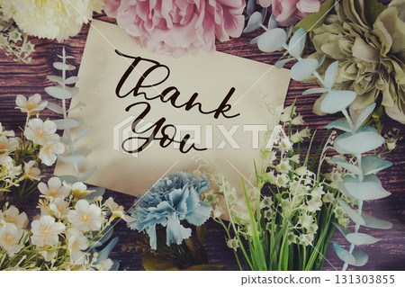 Thank You text with flowers bouquet decoration on wooden background Thank You text with flowers bouquet decoration on wooden background 131303855