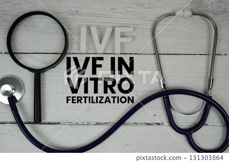 IVF In vitro fertilization text with Stethoscope on wooden background 131303864