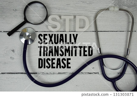 STD Sexually Transmitted Disease text with Stethoscope on wooden background STD Sexually Transmitted Disease text with Stethoscope on wooden background 131303871