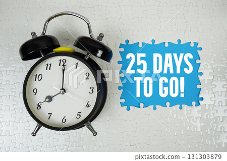 25 Days To Go! text with alarm clock on blue background 131303879
