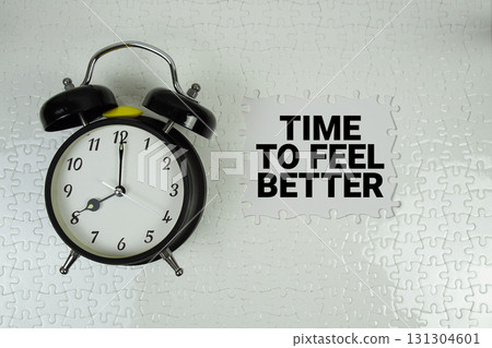 Time To Feel Better text with alarm clock on white background 131304601