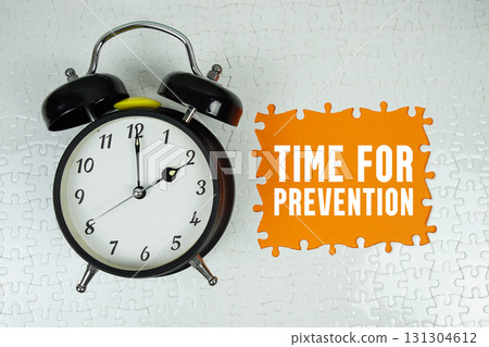 Time for Prevention text with alarm clock on orange background Time for Prevention text with alarm clock on orange background 131304612