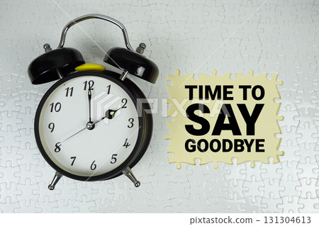 Time to Say Goodbye text with alarm clock on yellow background Time to Say Goodbye text with alarm clock on yellow background 131304613
