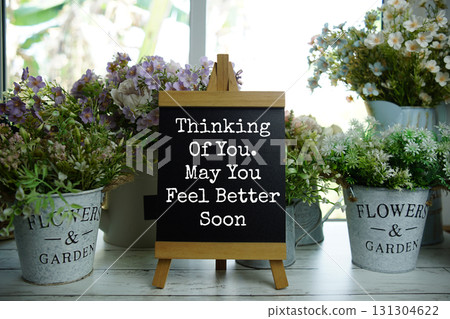 Easel with  Motivational And Inspirational Quotes "Thinking Of You. May You Feel Better Soon" 131304622