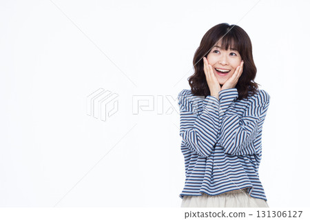 A woman smiling and surprised 131306127