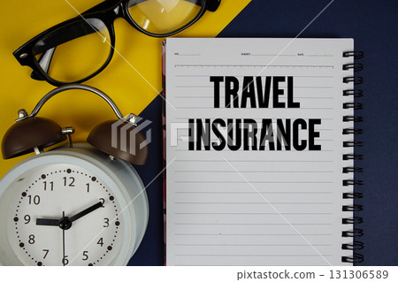 Travel Insurance text written on notepad with alarm clock on blue background 131306589