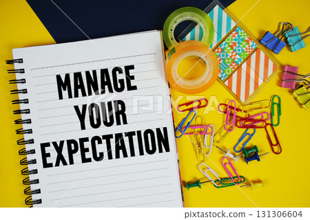 Manage Your Expectation text with stationery on yellow background Manage Your Expectation text with stationery on yellow background 131306604