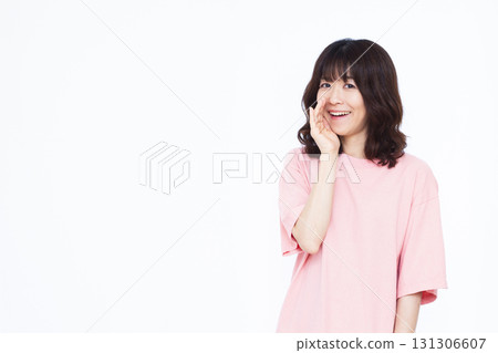 Smiling woman whispering 131306607