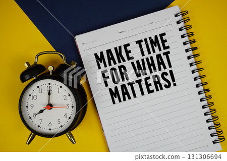 Make Time For What Matters! text written on notepad with alarm clock on yellow background Make Time For What Matters! text written on notepad with alarm clock on yellow background 131306694
