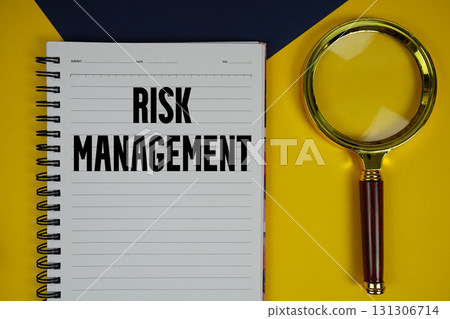 Risk Management text with magnifying glass on yellow background Risk Management text with magnifying glass on yellow background 131306714