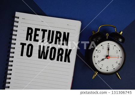 Return To Work  text written on notepad with alarm clock on blue background 131306745