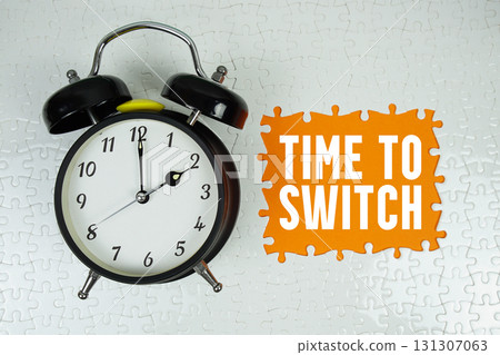 Time to Switch text with alarm clock on orange background 131307063