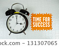 Time for Success text with alarm clock on orange background 131307065
