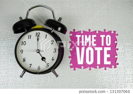 Time to Vote text with alarm clock on pink background Time to Vote text with alarm clock on pink background 131307068