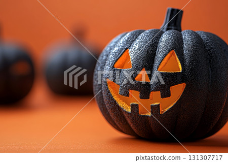 Black jack-o'-lantern with a glowing smile on a vibrant orange background for modern minimalist Halloween decor. Black jack-o'-lantern with a glowing smile on a vibrant orange background for modern minimalist Halloween decor. 131307717
