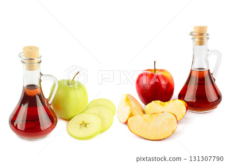 Two glass jugs with apple cider vinegar and fresh apples 131307790