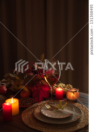 Autumn Table Setting with Pumpkins, Candles and Leaf Decor Autumn Table Setting with Pumpkins, Candles and Leaf Decor 131308495