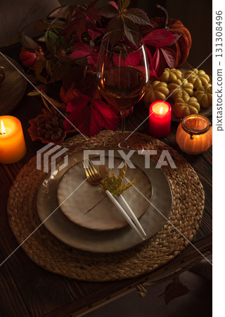 Autumn Table Setting with Pumpkins, Candles and Leaf Decor Autumn Table Setting with Pumpkins, Candles and Leaf Decor 131308496