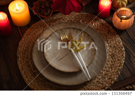 Autumn Table Setting with Pumpkins, Candles and Leaf Decor Autumn Table Setting with Pumpkins, Candles and Leaf Decor 131308497