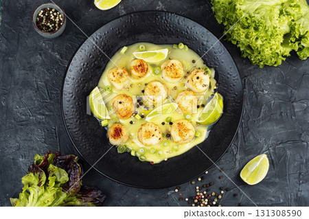 Searing Scallops in Butter. Searing Scallops in Butter. 131308590
