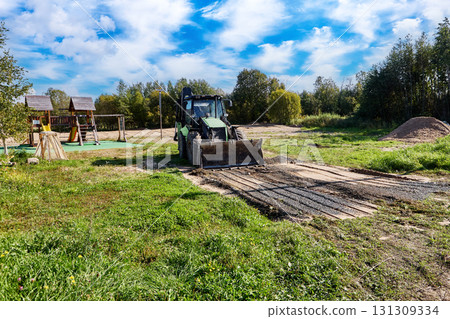 Detailed earthwork execution excavator guarantees precise ground alignment for construction needs. Detailed earthwork execution excavator guarantees precise ground alignment for construction needs. 131309334