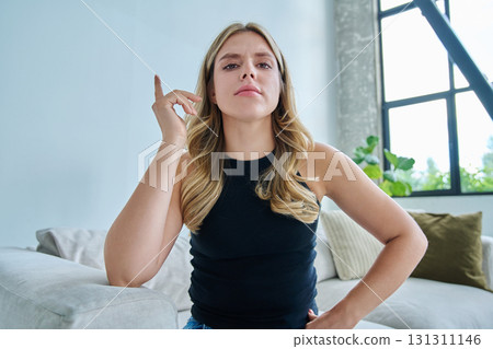 Web cam view of young woman talking looking in camera, online meeting, video call 131311146