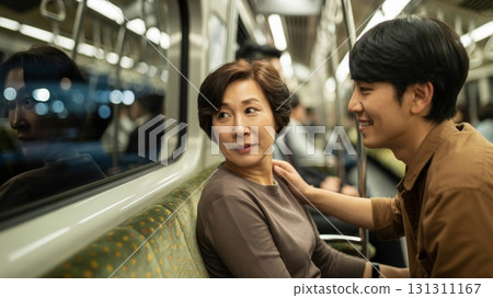 Middle-Aged Woman and Man Riding the Metro 131311167