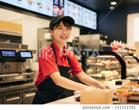 Smiling female fast food restaurant staff: customer service and part-time work 131311781