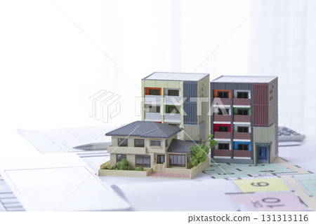 Image of considering building a house or purchasing real estate Image of considering building a house or purchasing real estate 131313116