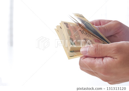 A man counting Japanese yen A man counting Japanese yen 131313120