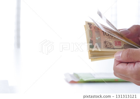 A man counting Japanese yen A man counting Japanese yen 131313121