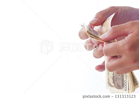 A man counting Japanese yen 131313123