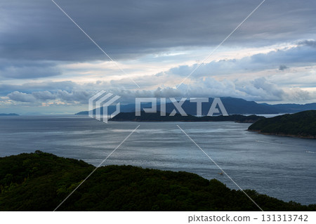 Early morning clouds cleared and visibility improved over the Wakayama Kitan Strait. Cumulus clouds floating above Awaji Island. 131313742