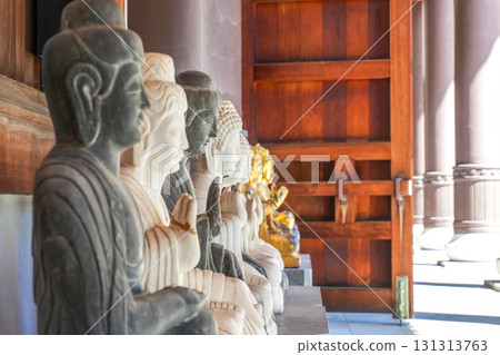 Multiple Buddha statues lined up at the Qing Da Mosque Multiple Buddha statues lined up at the Qing Da Mosque 131313763