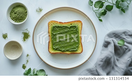 Matcha toast green topping flour for simple breakfast on white plate 131314534