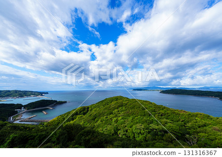 Wakayama Kitan Strait shining in the morning sun. Deep mountains bathed in the morning sun and a clear sky. 131316367