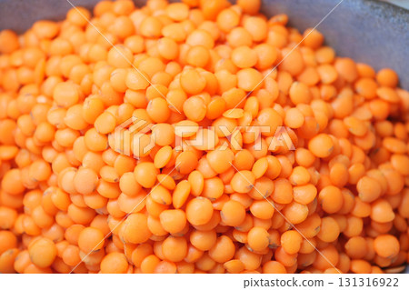 Bright orange lentils in a market display Bright orange lentils in a market display 131316922