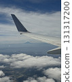 Aerial View of Airplane Wing and Sea of Clouds 131317200