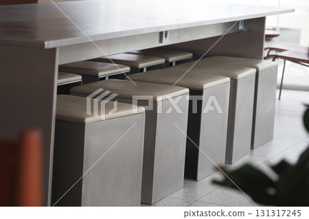 Minimalist seating arrangement in modern cafe interior 131317245
