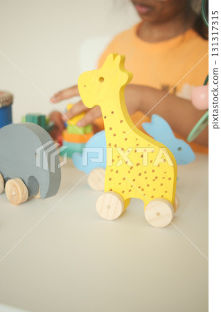 Colorful wooden toys on a table at playtime 131317315
