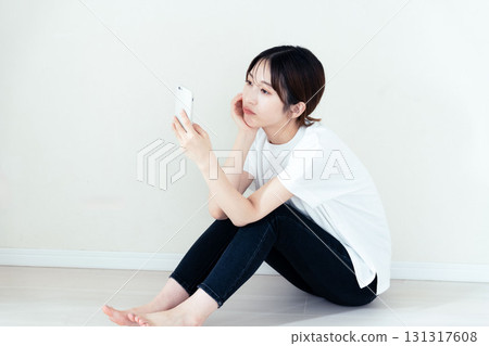 A woman using a smartphone 131317608