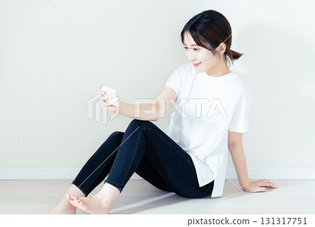 A woman using a smartphone 131317751
