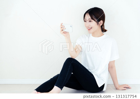 A woman using a smartphone 131317754